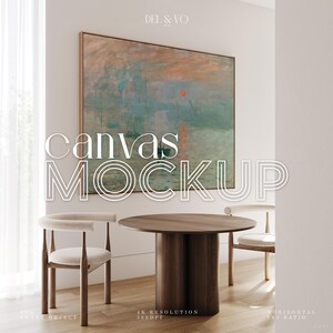 May include: A canvas mockup showing a large framed painting with a sunset scene in orange, blue, and green hues. The words "canvas mockup" are displayed in white. Two chairs and a round wooden table are in the foreground.