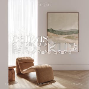 May include: A mockup of a canvas print featuring a landscape painting of green hills and a light brown background. The canvas is hanging on a white wall in a room with a brown chaise lounge and a wooden side table. The text "DEL & VO" is in the top left corner of the image. The text "Canvas MOCKUP" is in the centre of the image.