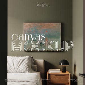 May include: A mockup of a canvas print in a bedroom setting. The canvas print is framed in a light wood frame and features a painting of a seascape with a red sun setting over the water. The canvas print is hanging on a sage green wall above a white bed with a white headboard and two white pillows. A wooden nightstand with a black lamp and a stack of books is to the right of the bed.