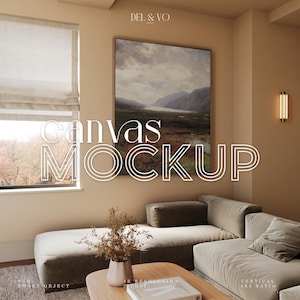 May include: A mockup of a canvas print in a living room setting. The canvas print features a landscape painting with a lake and mountains. The print is hanging on a light beige wall above a brown sectional sofa. The text "Canvas Mockup" is superimposed on the image.