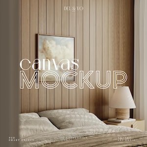 May include: A mockup of a canvas print with a painting of clouds in a bedroom setting. The canvas is framed in a light brown wood frame and is hanging on a wood wall. A bed with a white and brown blanket is in the foreground. A lamp is on a nightstand next to the bed.