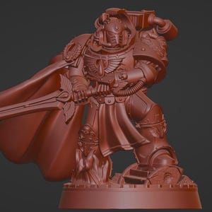 May include: A monochromatic reddish-brown miniature figurine of a futuristic armoured warrior in a dynamic pose. The figure wears ornate power armour with a winged chest emblem, a flowing cape, and holds a long sword with both hands.