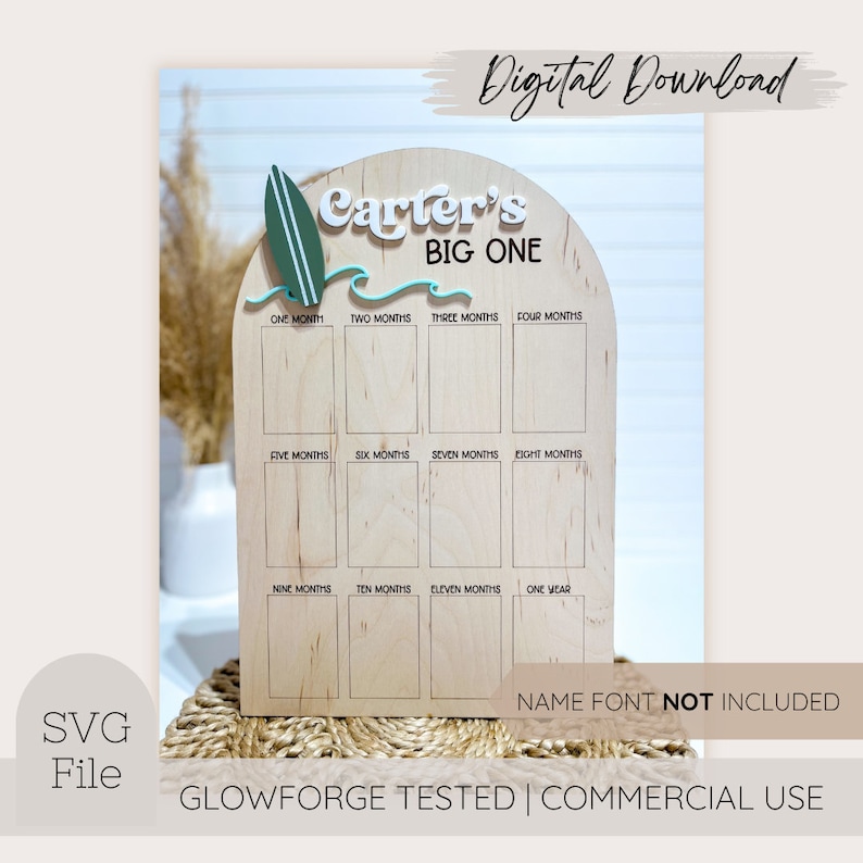 May include: Wooden milestone board with the text "Carter's BIG ONE" and a surfboard graphic. The board has spaces for photos from one month to one year. The words "Digital Download", "SVG File", and "Name Font NOT INCLUDED" are also visible.