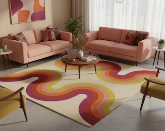 May include: A living room scene featuring two pink sofas, a round wooden coffee table, and a colorful rug with a wavy design in shades of yellow, orange, and purple. Decorative pillows and artwork complete the space.