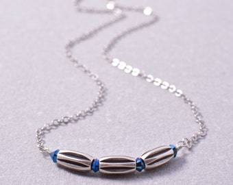 Dainty Silver Bar Necklace With Three Tubular Rice Beads and Blue Swarovski Crystals