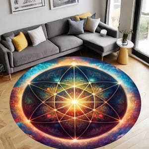 May include: A round rug with a colorful geometric design. The design features a large, golden mandala with a starburst pattern. The background is a dark blue with hints of purple and red.
