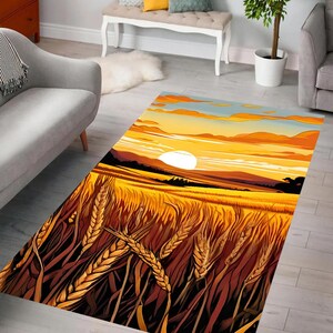 May include: A sunset scene with a large sun and clouds over a field of wheat. The wheat is brown and gold and the sun is yellow. The sky is blue and orange.