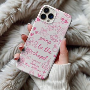 May include: White iPhone case with a pink design featuring wedding-themed illustrations and the text "going to the chapel" and "Future Mrs. Williams".