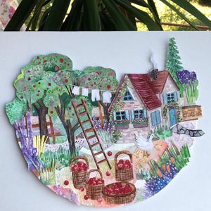 May include: A layered paper collage illustration depicting a cottage with a red roof, a wooden ladder, and apple trees. Three woven baskets filled with red apples sit on the ground near a white goose and chicks, with laundry hanging on a line.