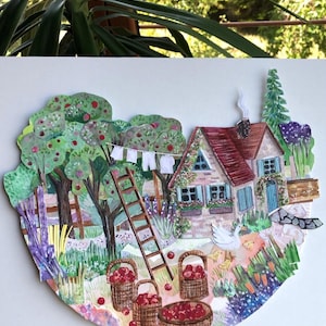 May include: A layered paper collage illustration depicting a cottage with a red roof, a wooden ladder, and apple trees. Baskets filled with red apples sit on the ground near a white goose and chicks. A clothesline with white laundry hangs nearby.