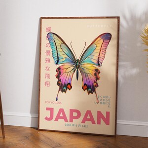 May include: A vintage poster with a colorful butterfly illustration and the text "蝶の優雅な飛翔" (Japanese for "Elegant Butterfly Flight") and "JAPAN" in pink lettering. The poster also includes the text "TOKYO 1965" and "1965年 6月 14日" (Japanese for "June 14, 1965").