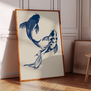 May include: A framed print of two blue koi fish swimming in a stylized design. The fish are outlined in black and have a white background.
