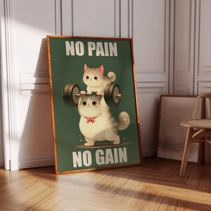 May include: A motivational poster with a green background featuring two cartoon cats. The larger cat is lifting a barbell with the smaller cat sitting on top. The text on the poster reads "No Pain No Gain".