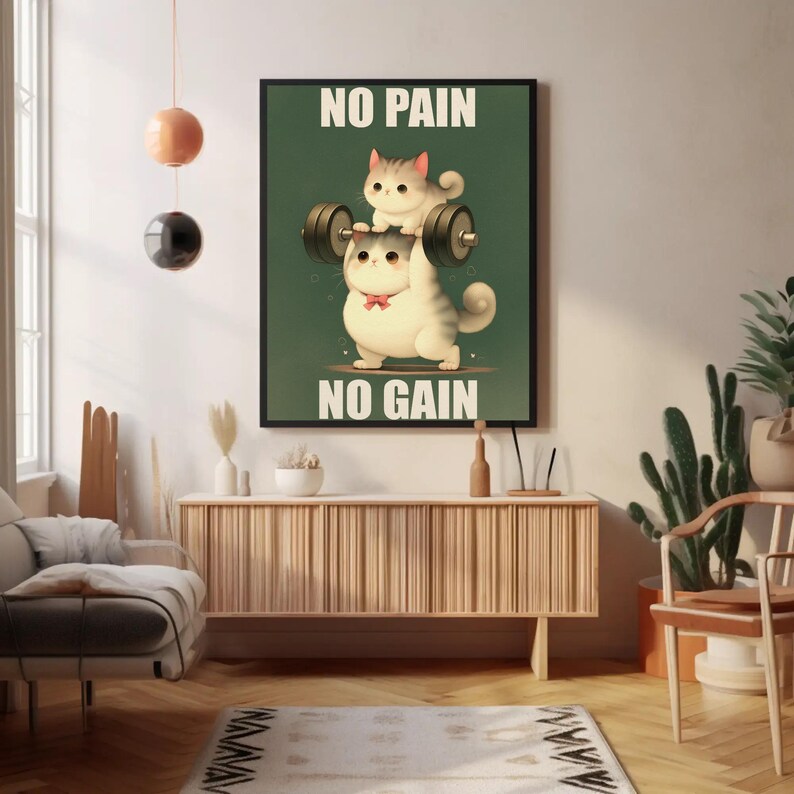May include: A motivational poster with a green background featuring two cartoon cats lifting a barbell. The text on the poster reads "No Pain No Gain".