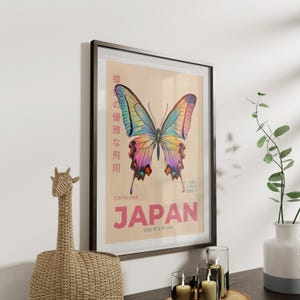 May include: A vintage poster with a colorful butterfly illustration and the text "蝶の優雅な飛翔 TOKYO 1965 JAPAN 1965年6月14日".