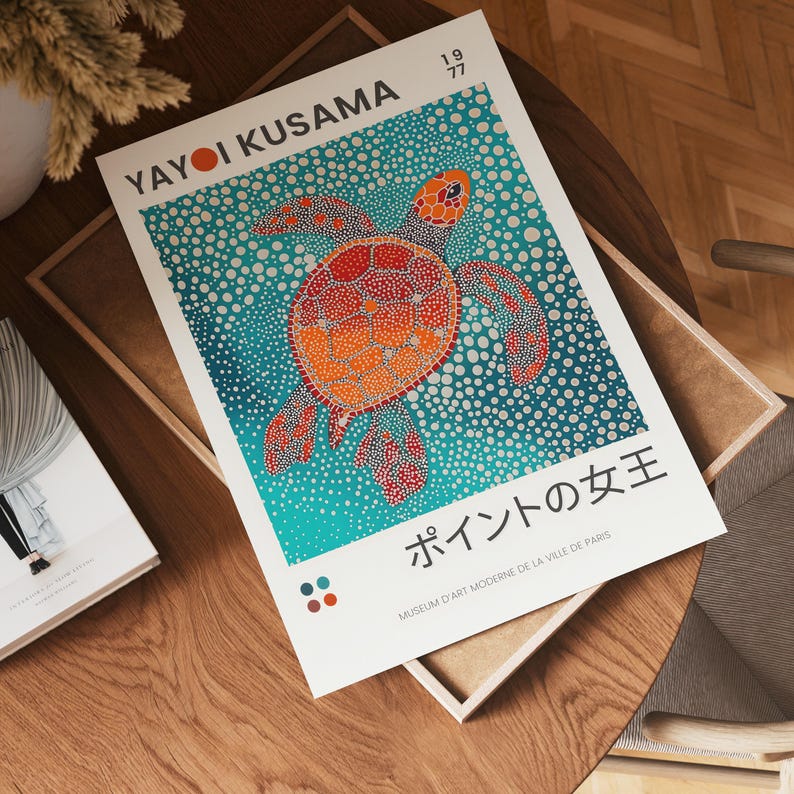 May include: A colorful poster featuring a red, orange, and yellow turtle swimming in a blue and white polka dot ocean. The poster is titled "Points of the Queen" and is from the Museum of Modern Art in Paris.