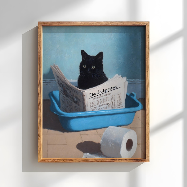 May include: A framed painting depicts a black cat sitting in a blue litter box, reading a newspaper titled "The Daily News." A roll of toilet paper sits nearby. The background is a light blue wall.