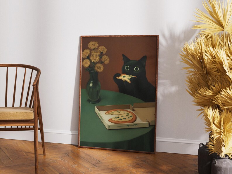 May include: A framed art print depicts a black cat eating pizza. The cat has large, round eyes and is seated at a green table. A vase of yellow flowers and a pizza box are also on the table. The artwork has a vintage aesthetic.