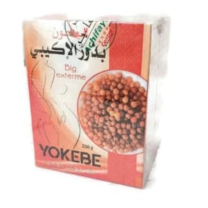 May include: A box of YOKEBE, with text in Arabic and English. The box has a red and white design, with an illustration of a woman's silhouette. A circular image shows brown pellets. The box contains 250g.