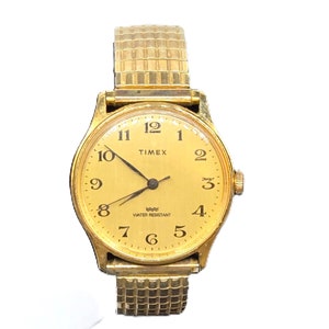Vintage Timex Watch, Men's Gold-Tone Water Resistant, Stainless Steel Back, Stretch Band Stamped Speidel USA,  Mechanical, Arabic Numerals
