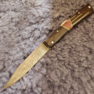 Forged folding knife, damascus, front pump, ebony and brass marquetry