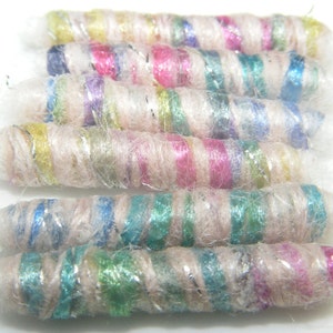 Set of 6 fabric beads. We judge ourselves by fiber and color. The bead buyer will judge us by what can be made of us. Fiber Bead loose tube