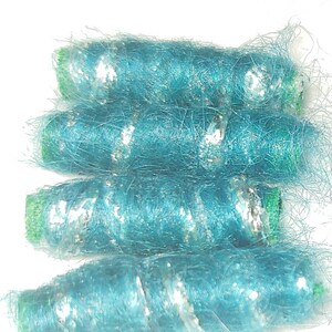 Set of 6 beads. Now that we have a voice, what should we say? Something about teal, for sure. Artisan fiber dread tube barrel bead