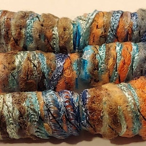 Set of 6 Fiber Beads. She says we have shadows. Yes, but isn't there makeup for that fabric dread bead, macrame tube, soft jewelry barrel Lt blue brown orange