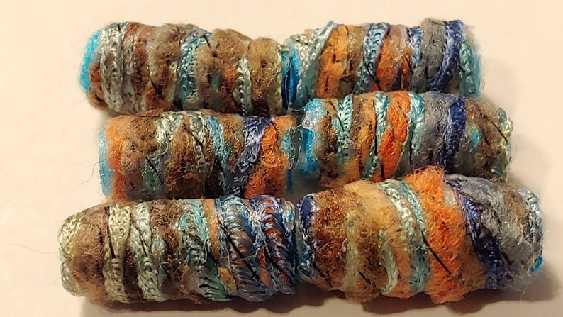 Set of 6 Fiber Beads. She says we have shadows. Yes, but isn't there makeup for that fabric dread bead, macrame tube, soft jewelry barrel Lt blue brown orange