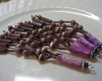 Dangles,charms, embellishment. Set of 4 mauve Fiber, crystal and beaded embellishments.