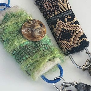 Set of 2 Top and bottom loop dangles Multicolors. One of a kind multi-media play.