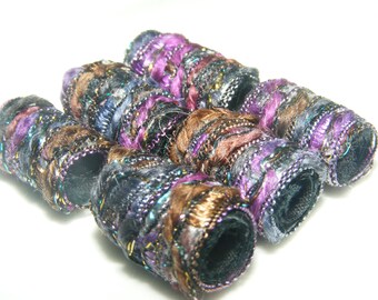 Set of 6 beads. She says in order to understand fiber beads you have to appreciate color and glitter. Understand this. fabric barrel slide