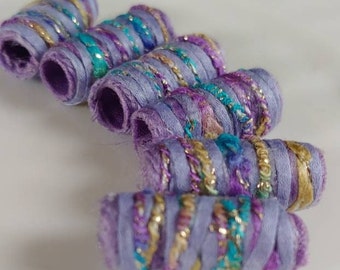 Set of 6 fabric beads. No battles over the Ruler of Purple today. Look at our color and sparkle! Fiber Bead dread tube, macrame barrel