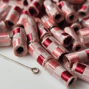 Mini fabric beads. She was thinking &#39;cute little stinkers.&#39; We were thinking, &#39;do we smell? Lightweight fabric beads, slow stich s