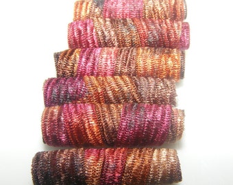 Set of 6 fabric beads. We've been called funny,  but unusual. You'd think no one has ever seen rust colored Fiber Beads before. dread tube