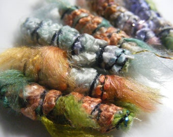 Set of 6 fabric beads. The weather outside is frightful but our bead textures are so delightful. Fiber Bead tube barrel, dread macrame slide