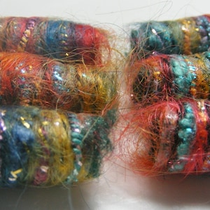 Set of 6 fabric beads. She wants us to keep a secret. Look at our vibrant selves. Do we look like we can keep secrets? artisan fiber slide