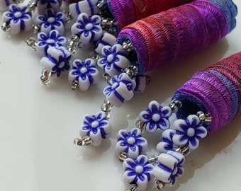 Set of 4 beads, earrings optional.  Tiny blue flower dangles make us a one of a kind design. acrylic fringe, lightweight dread loc sleeve