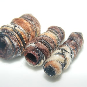 Set of 6 Fiber Beads. They say complete satisfaction doesn't exist. Looking at ourselves, we find it hard to believe. , artisan fabric tube image 6