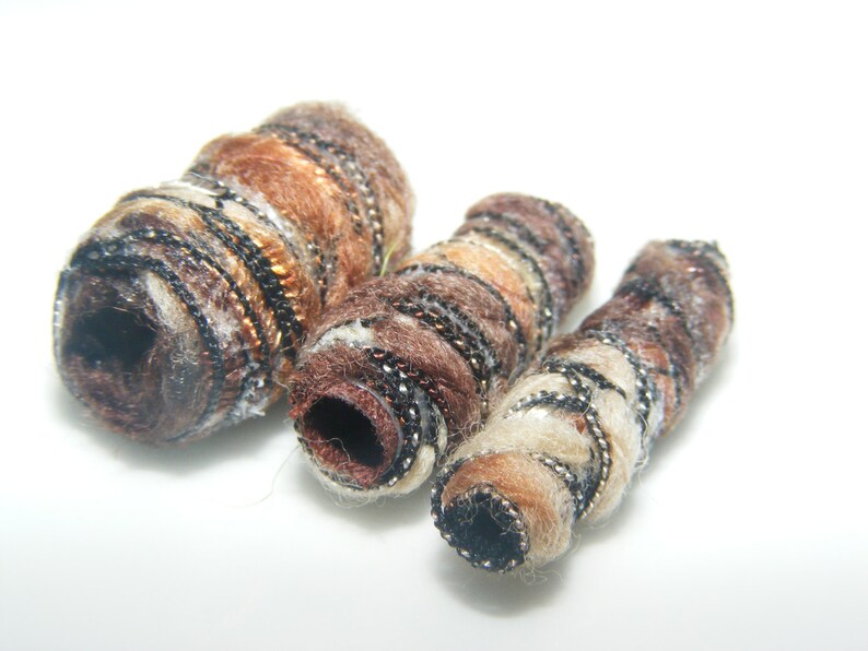 Set of 6 Fiber Beads. They say complete satisfaction doesn't exist. Looking at ourselves, we find it hard to believe. , artisan fabric tube image 6