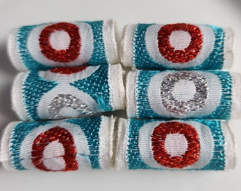 Set of 6 fabric beads. Silver and red stitched circles  in a sea of blue. Textile bead dread loc sleeve, big hole, wide hole tube