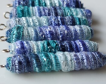 Set of 6 fabric beads. Perriwinkle twinkle. We like it. It sort of rolls off the tongue. Fiber wrap tube