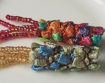 Set of 4. She said mosaic style. We said ok, but FIBER mosaic, please. Textile beads,  lightweight dread beads, unique dread loc sleeve