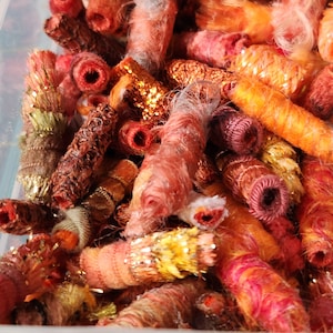 Fiber Bead Mini Hey there mates! A little bright orange to perk up your art work. And we do mean little. Light fabric slow stich add on