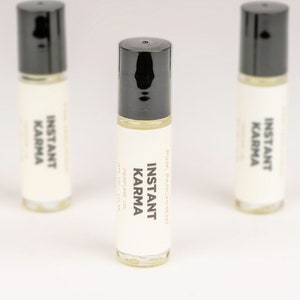 Instant Karma Roll On Perfume Oil - A powdery blend of patchouli and dragon&#39;s blood