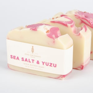 Handmade Sea Salt & Yuzu Soap. This soap is off white and pink with sea salt on top. It is also very pretty