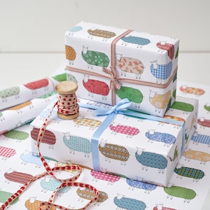 Carta da regalo con pecore colorate