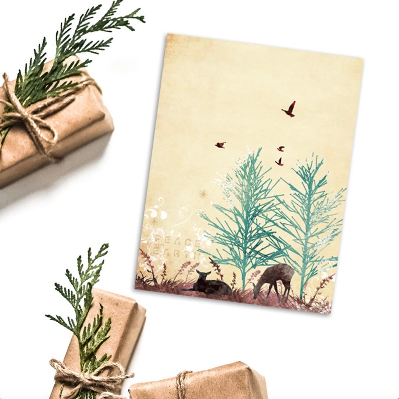 May include: A vintage-style greeting card with deer, trees, and birds. The card reads "PEACE ON EARTH". Wrapped gifts with twine and greenery are arranged around the card, creating a festive scene.