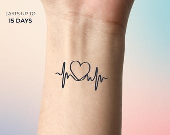 May include: A black temporary tattoo on skin featuring a continuous line drawing of a heartbeat rhythm with a heart shape in the center. The text "LASTS UP TO 15 DAYS" is printed in black above the tattoo design on the left side.