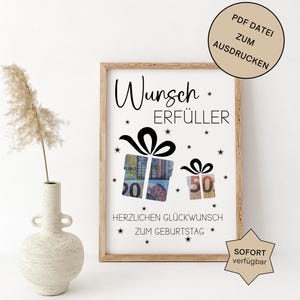 Puede incluir: Una impresión enmarcada con las palabras "Wunsch Erfüller" y "Herzlichen Glückwunsch zum Geburtstag". La impresión presenta ilustraciones de cajas de regalo con divisas que representan los números 20 y 50. También hay un círculo beige y una etiqueta en forma de estrella con texto.